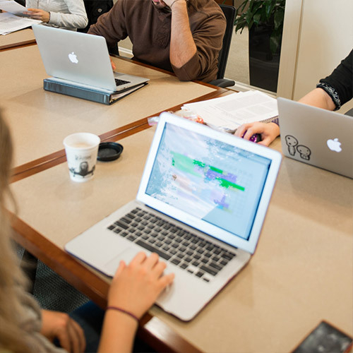Tables with people at laptops