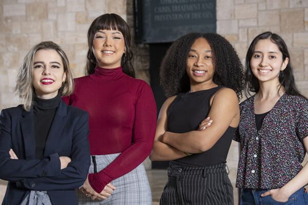 Group photo of four Research Scholars at the Stowers Institute