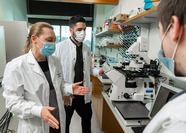 Tamara Potapova, PhD, Leonardo Gomes de Lima, PhD, and Matt Borchers in the lab